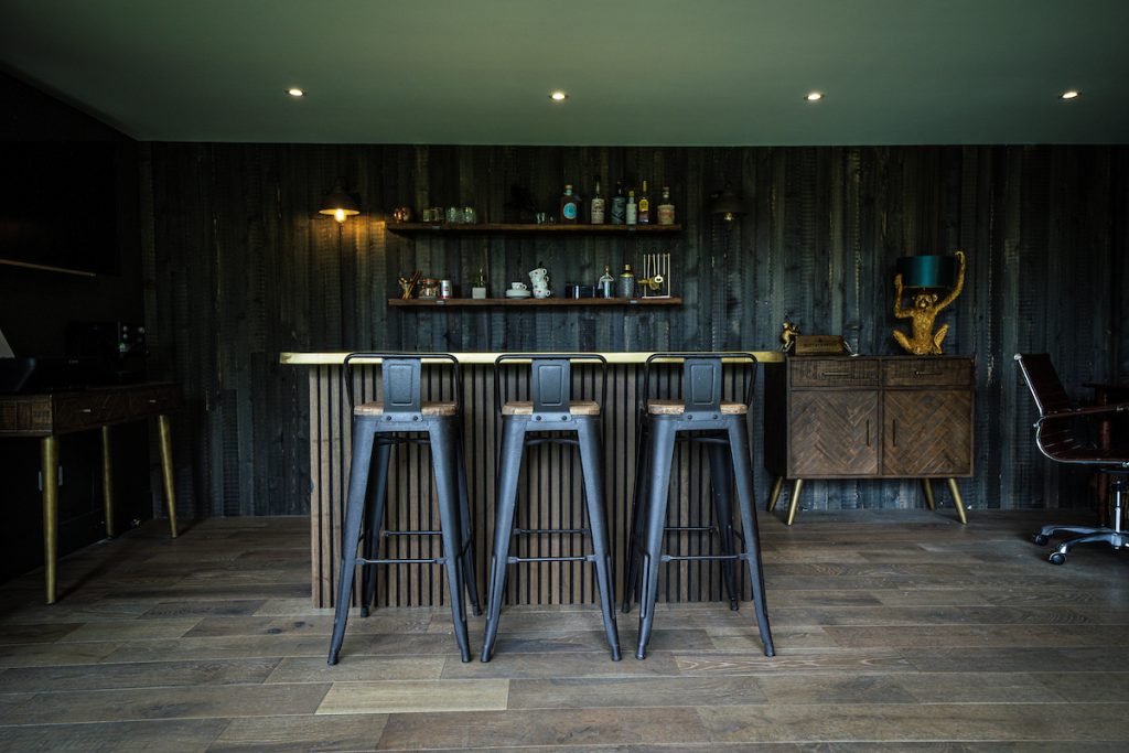 Stylish black chairs with long legs in a contemporary room