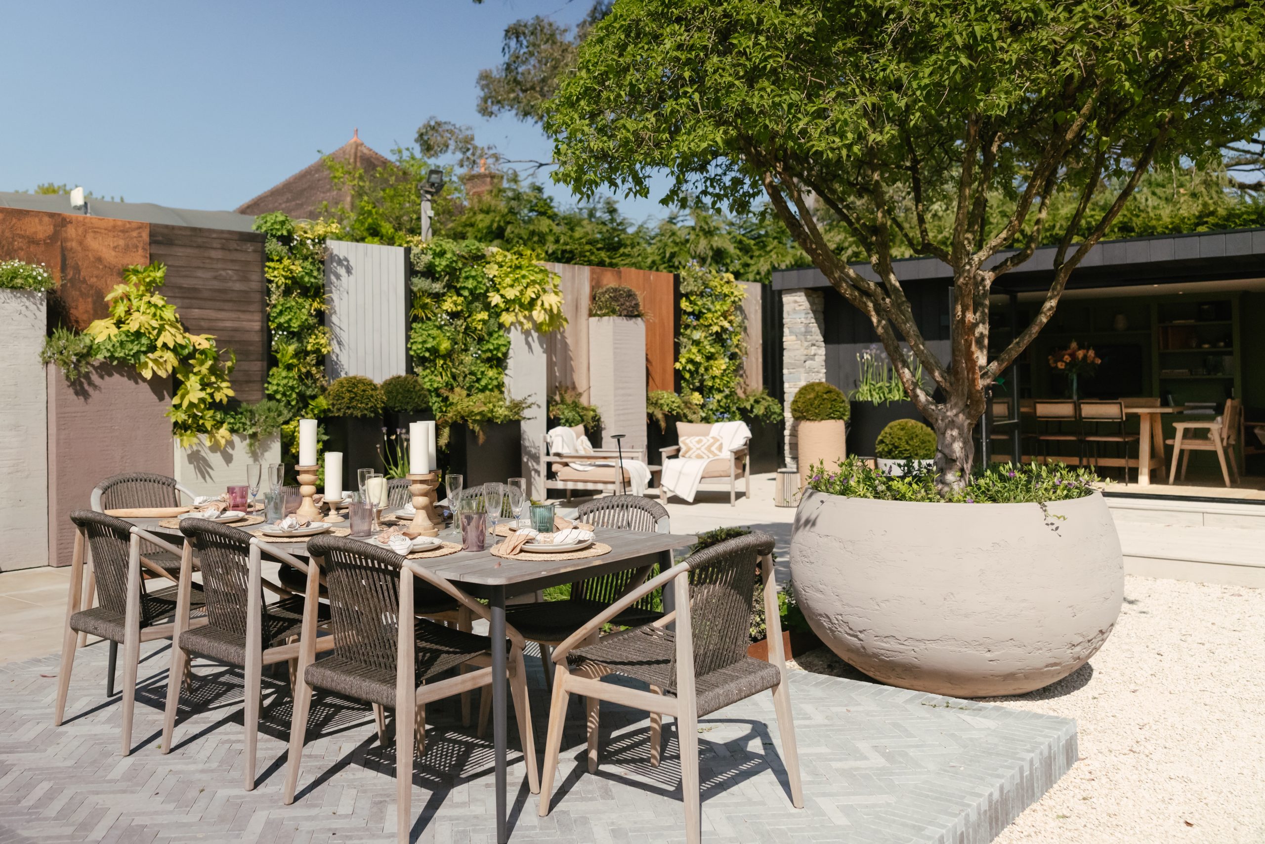 Outdoor dining table set on a garden terrace