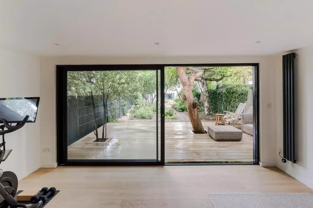 Bright garden room interior with glazed doors onto the garden